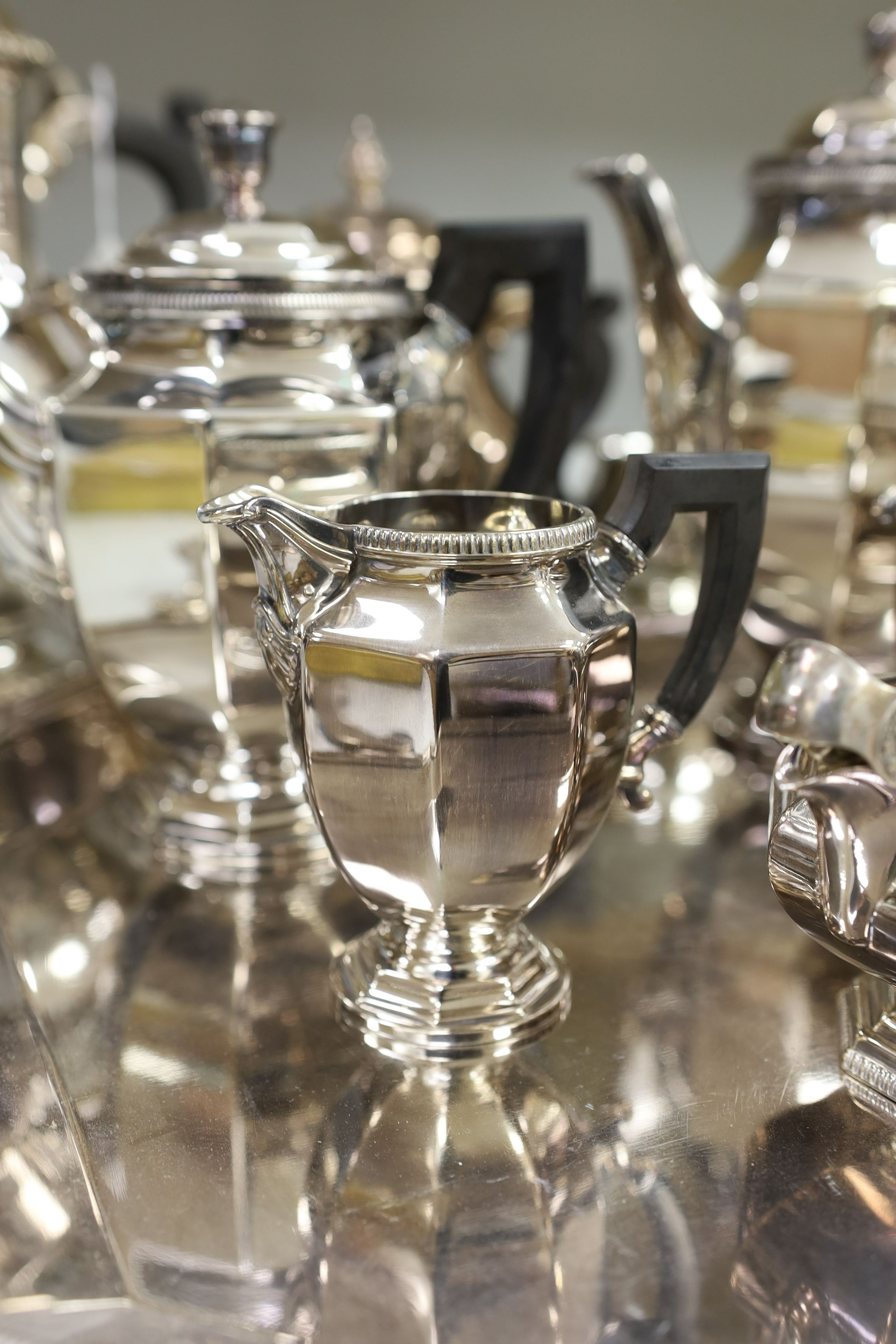 A French plated Cristofle tea set, together with other plated tea wares and a candelabrum